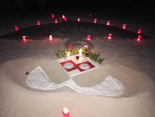 a christmas display in the sand at night at Masfalhi View Inn in Felidhoo