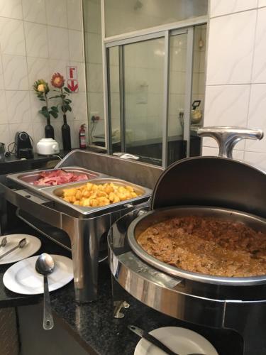 a kitchen with some food on a counter at Cranberry Cottage in Ladybrand