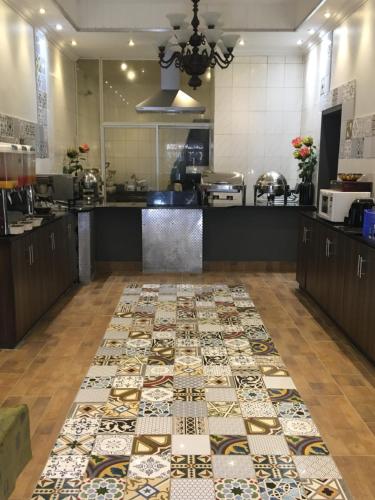 a kitchen with a rug on the floor at Cranberry Cottage in Ladybrand