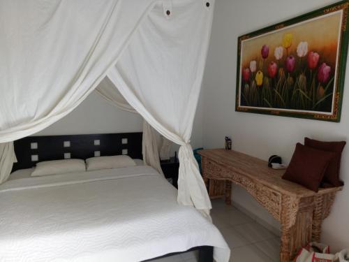 Ένα ή περισσότερα κρεβάτια σε δωμάτιο στο Villa Esa Ubud
