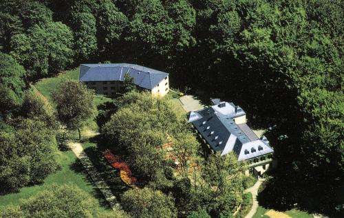 an aerial view of a house in the trees at Hotel Haus Hohenstein in Witten