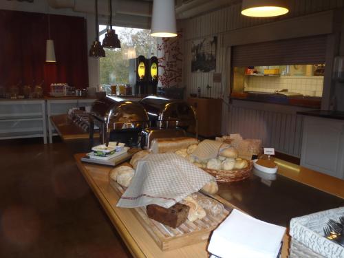 a kitchen with a table with bread on it at STF Malmfältens Folkhögskola in Kiruna