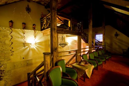 a group of chairs in a room with a wall at Resort Jura in Kroczyce