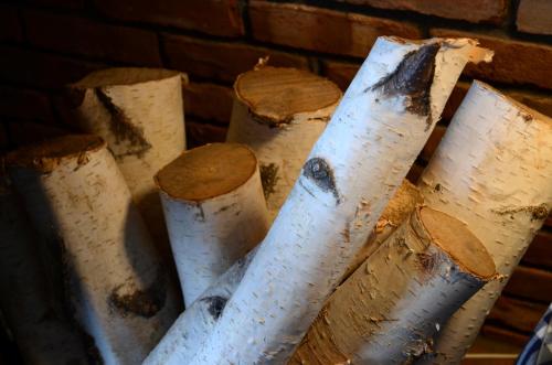 a group of white wooden posts next to a brick wall at Greenbrier Inn Killington in Killington