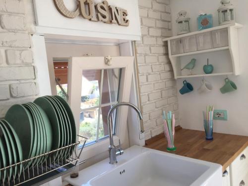 a kitchen with a sink and a window at Chic & Beauty in Agrigento