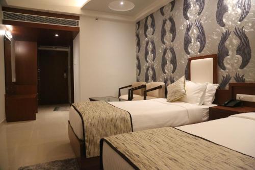 Hotel Varanasi Innにあるベッド