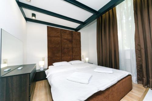 Ένα ή περισσότερα κρεβάτια σε δωμάτιο στο VIP Apartment at Horodetskoho 4