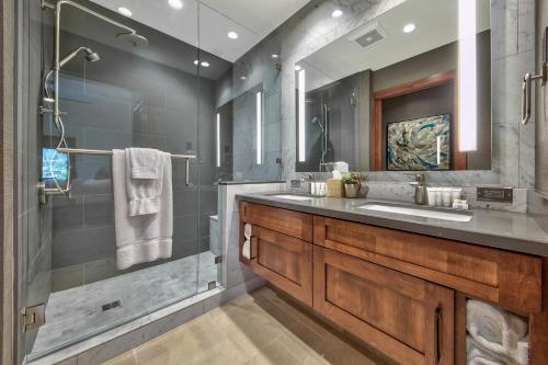 a bathroom with a glass shower and a sink at Zalanta in South Lake Tahoe