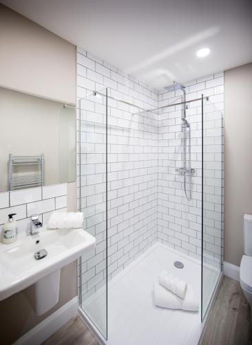 a bathroom with a shower and a sink at Darlington Arms in Redhill