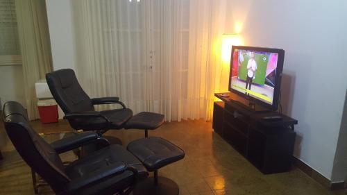 A television and/or entertainment center at Departamento del Mar