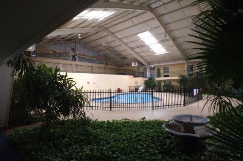 a swimming pool in a building with a swimming pool at Econo Lodge Elk City in Elk City