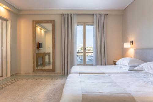 Postel nebo postele na pokoji v ubytování Porto Naxos