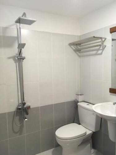 a bathroom with a toilet and a sink at The Alley Hostel in Nha Trang