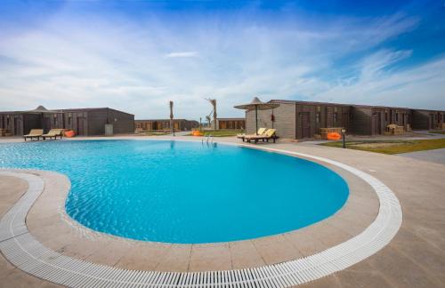Bazén v ubytování Fade Hotel by La Hacienda Ras Sudr nebo v jeho okolí