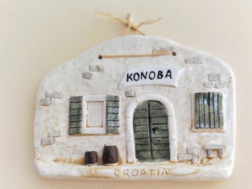 a small model of a building with a door at Apartments Kristina in Klenovica