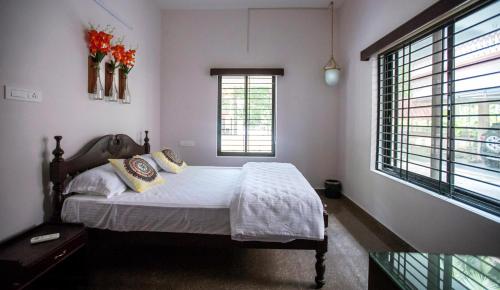 A bed or beds in a room at Anchorage Serviced Apartments