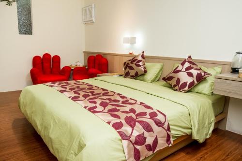 Katil atau katil-katil dalam bilik di Ji Shih Life Style Hotel