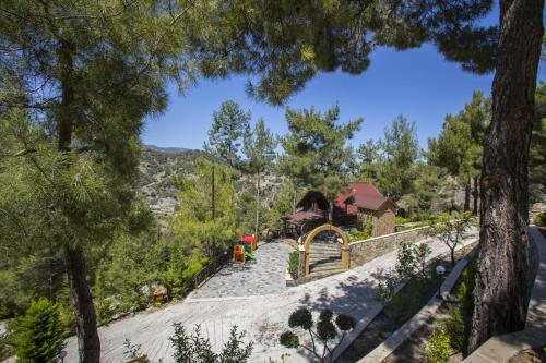 a view of the house from the trees at Ricky Chalet Near Troodos in Spilia