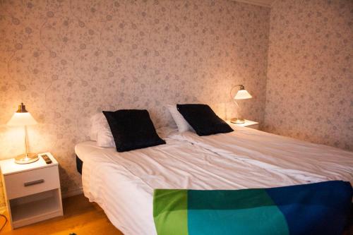 Tempat tidur dalam kamar di Brovaktarstugan