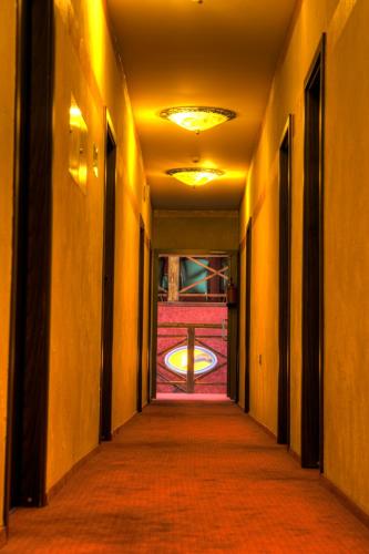 an empty hallway in a building with a window at Resort Jura in Kroczyce