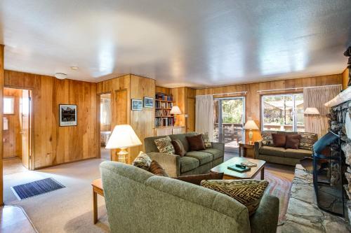 a living room with a couch and a table at 27A Pine Crest in Wawona