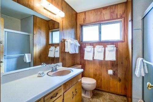 a bathroom with a sink and a toilet and a mirror at 27A Pine Crest in Wawona