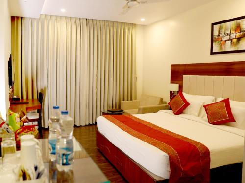 Ένα ή περισσότερα κρεβάτια σε δωμάτιο στο Hotel Tridev