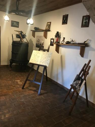 a room with a table and two chairs and shelves at B&B La Staffa in Aquino
