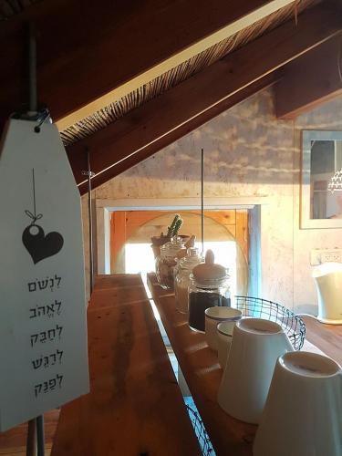 a kitchen with a counter with pots and pans at Healing Hands in Merom Golan