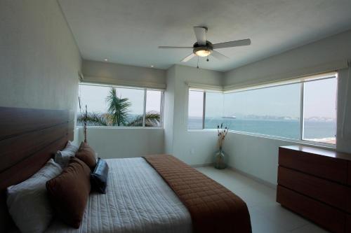 Ένα ή περισσότερα κρεβάτια σε δωμάτιο στο Condominio Marlica