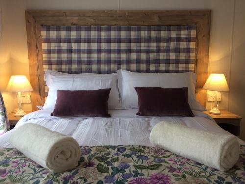 Ένα ή περισσότερα κρεβάτια σε δωμάτιο στο Cragganmore Lodge