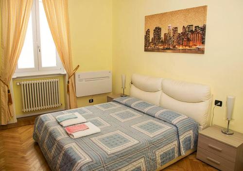 a small bedroom with a bed and a window at B&B Borfuro in Bergamo