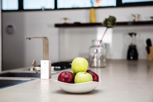 a bowl of apples on a counter in a kitchen at Villa Breg in Labin