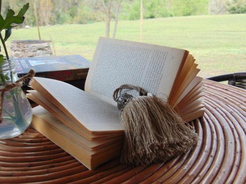 an open book sitting on top of a table at Cabañas Puente Negro in Puente Negro