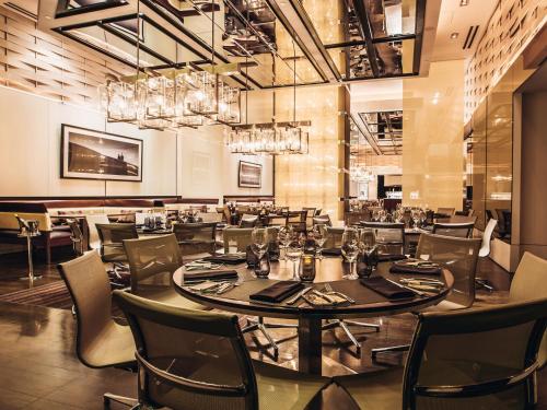a dining room with a table and chairs at The Venetian® Resort Las Vegas in Las Vegas