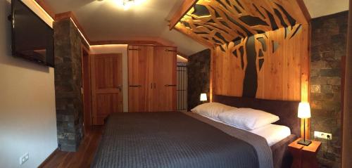 a bedroom with a large bed in a room at Landhaus Marlies in Zell am See