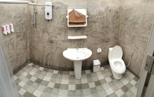 a bathroom with a sink and a toilet at Kama Siri Koh Kood in Ko Kood