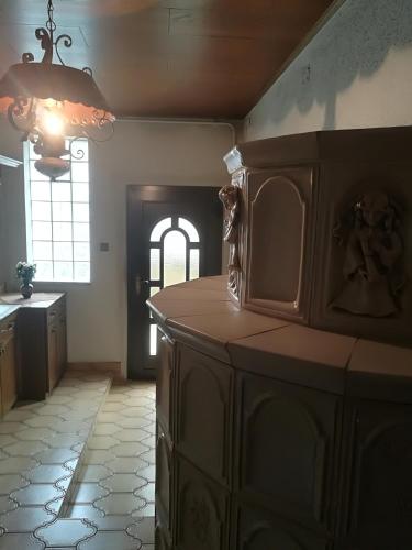 a kitchen with a large cabinet and a window at Haus Mitterfeld in Kasten bei Böheimkirchen