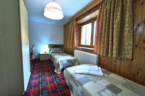 Postel nebo postele na pokoji v ubytování Hotel Paradisia