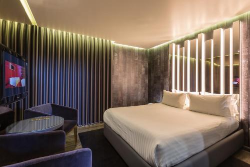 מיטה או מיטות בחדר ב-Motel Tropicana