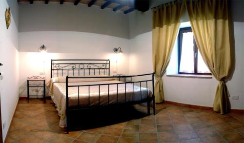 Tempat tidur dalam kamar di Belvedere Cramaccioli