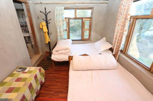 Postel nebo postele na pokoji v ubytování Patlekhet Community Homestay