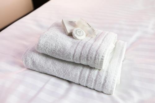Postel nebo postele na pokoji v ubytování Hotel U Kostela
