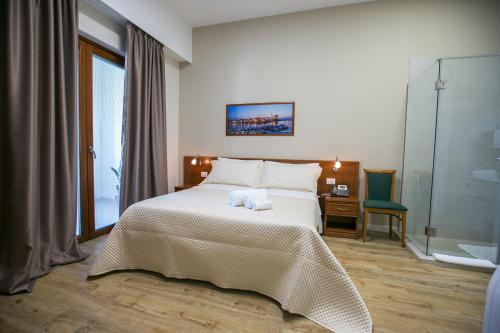 Säng eller sängar i ett rum på Residence Trani