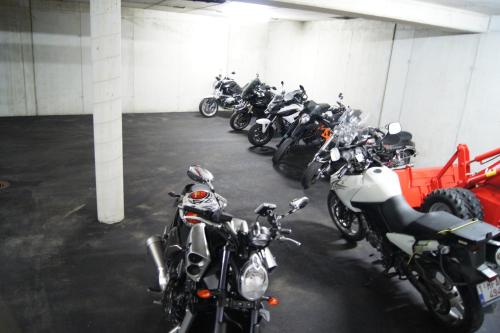 a row of motorcycles parked in a parking garage at Sport Garni Kapplerhof – Ischgl/Kappl in Kappl