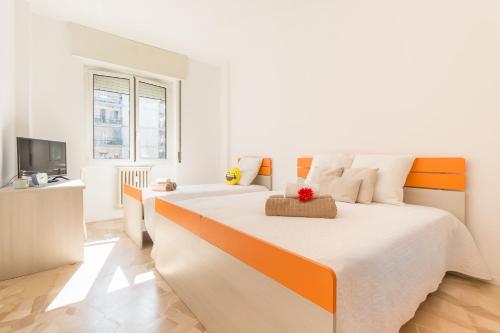 Postel nebo postele na pokoji v ubytování Alessia's Flat- Boncompagni