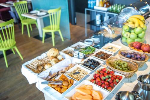 a table topped with lots of different types of food at Best Western Kutaisi City Center in Kutaisi