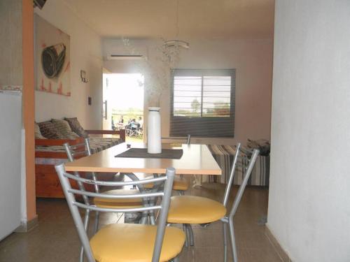 a kitchen with a table and chairs in a room at HM San Jose in San José