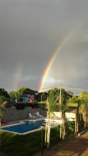 a rainbow over a swimming pool with at HM San Jose in San José