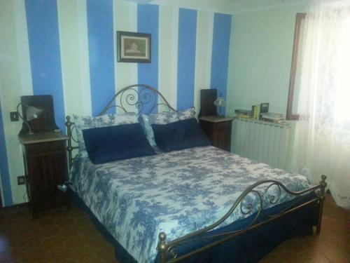 En eller flere senger på et rom på Sassipiantati Home Holidays